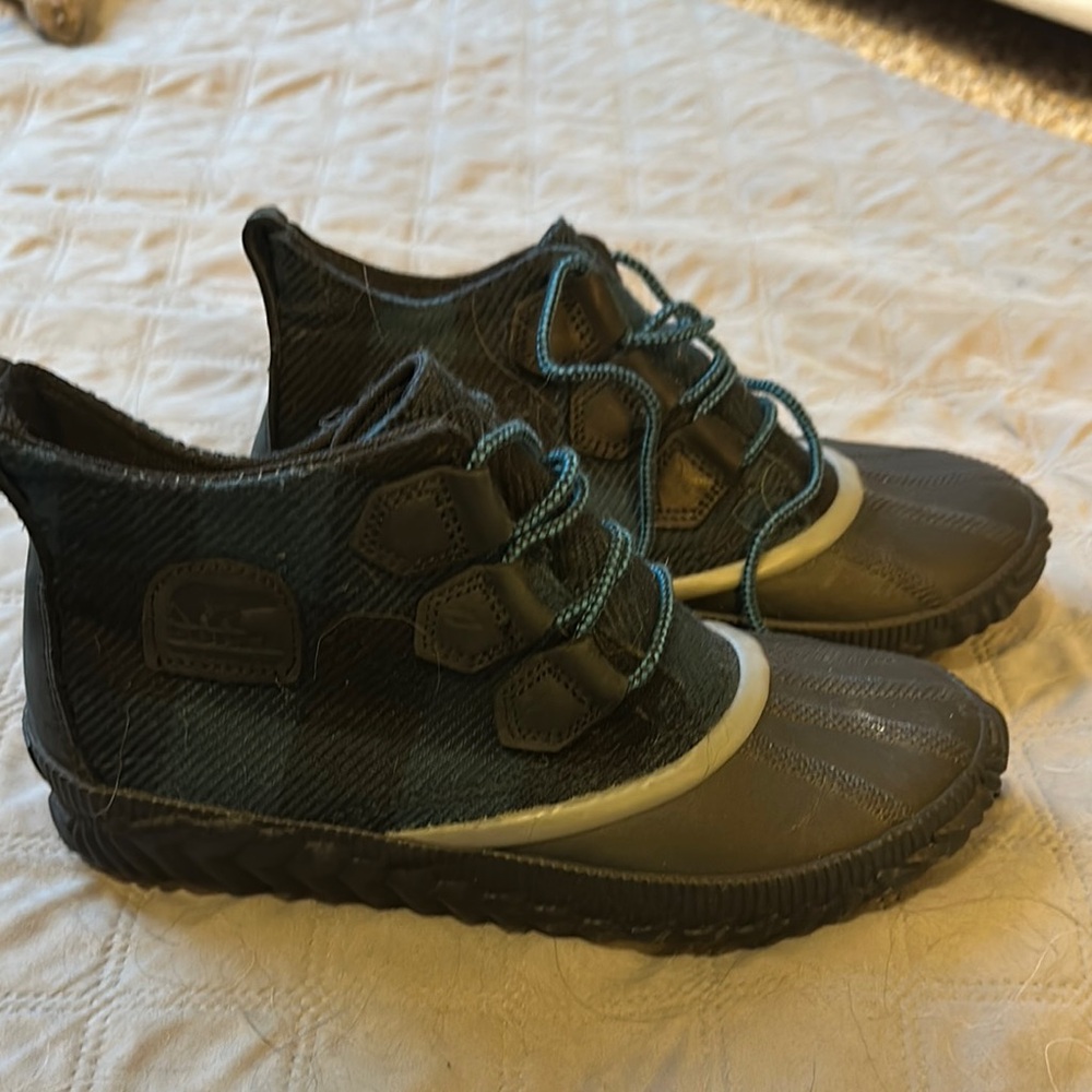 Black Ankle Boots with Rugged Design and Distinctive Lacing